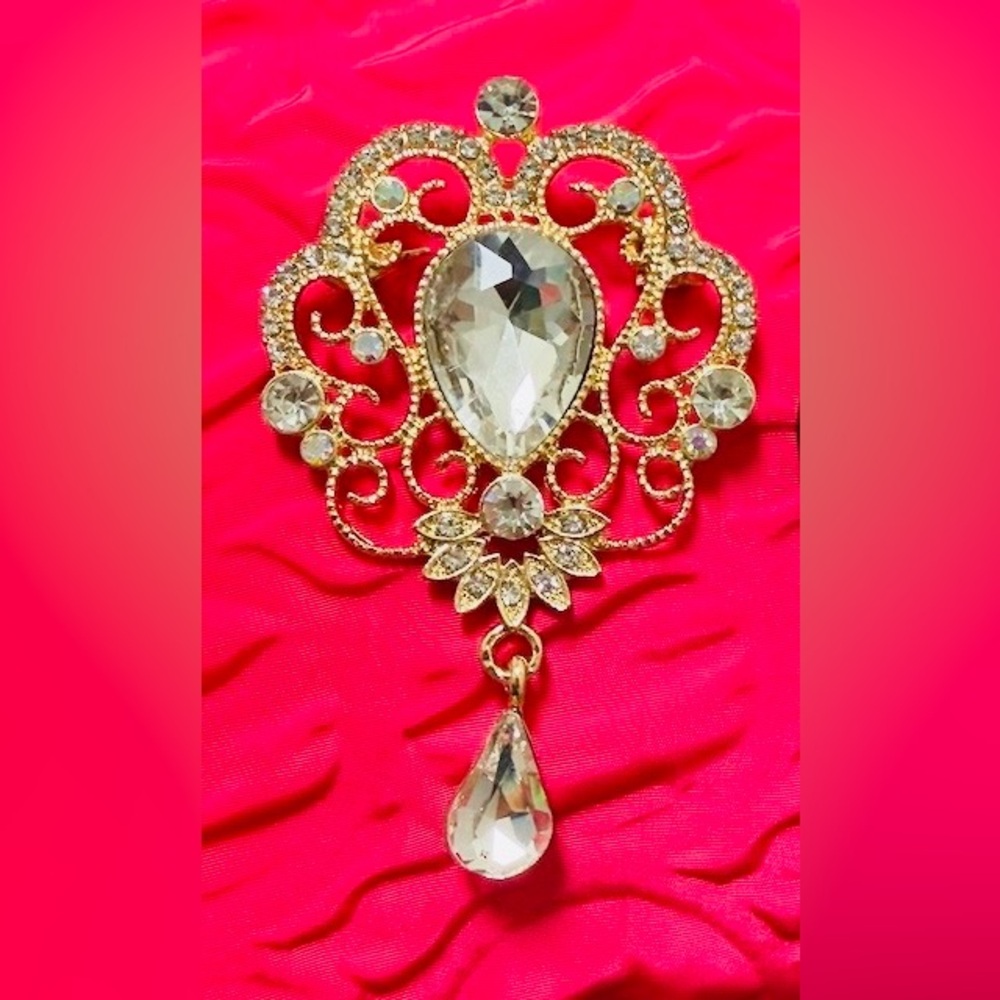 Elegant Gold and Crystal brooch